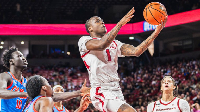 Razorbacks guard Johnell Davis drives for a layup against Ole Miss