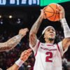 Razorbacks point guard Boogie Fland going up for a shot against Florida