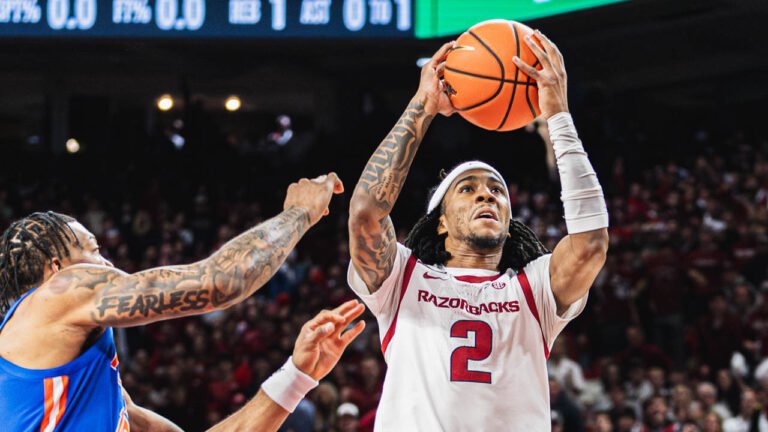 Razorbacks point guard Boogie Fland going up for a shot against Florida