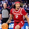 Razorbacks guard Boogie Fland brings the ball upcourt against LSU