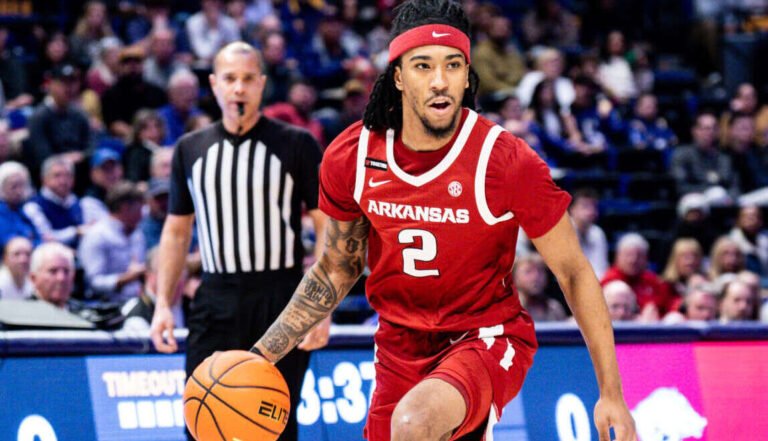 Razorbacks guard Boogie Fland brings the ball upcourt against LSU