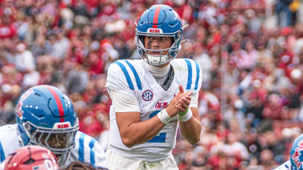 Rebels quarterback Jaxson Dart waits on snap from center against Arkansas