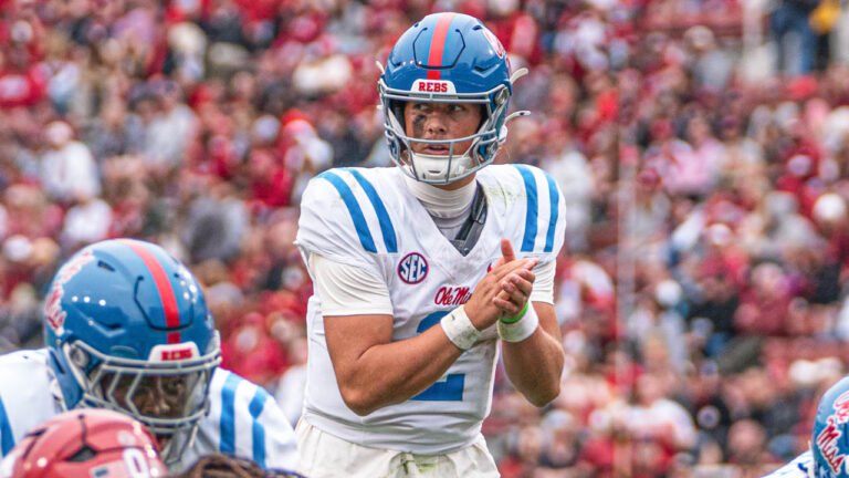 Rebels quarterback Jaxson Dart waits on snap from center against Arkansas