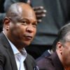 Razorbacks assistant coach Kenny Payne on the bench with fellow assistant Chuck Martin and coach John Calipari against UCA