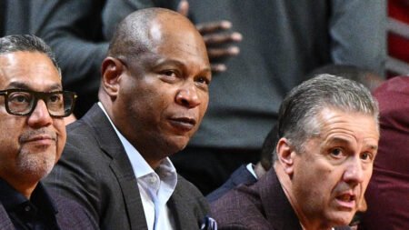 Razorbacks assistant coach Kenny Payne on the bench with fellow assistant Chuck Martin and coach John Calipari against UCA