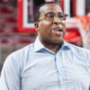 Razorbacks assistant coach Chin Coleman on the floor in warmups before a game against Oakland