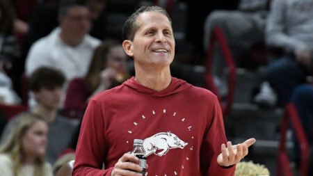 Razorbacks coach Eric Musselman on the sidelines in a game against UNC-Wilmington